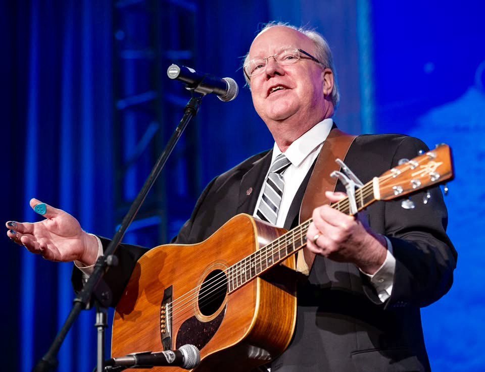 Marty Breeden playing acoustic guitar
